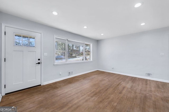 foyer entrance featuring wood-type flooring