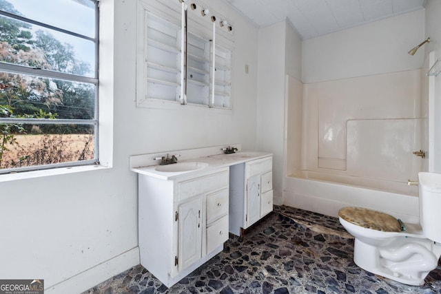 full bathroom with shower / washtub combination, vanity, and toilet