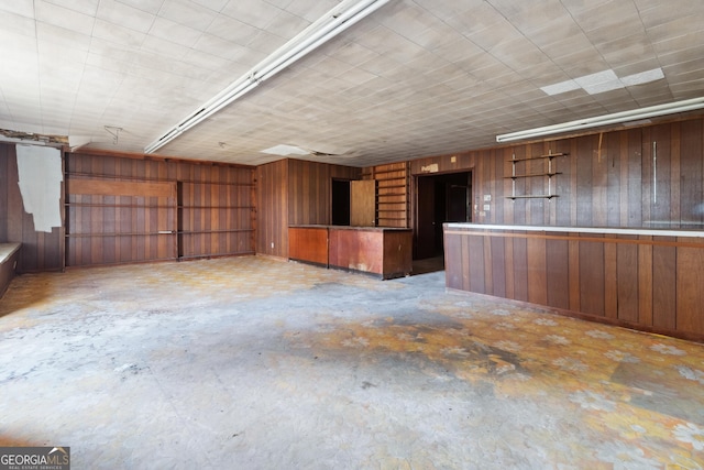 interior space featuring wooden walls