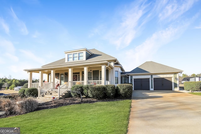 view of front of house featuring an attached garage, a porch, concrete driveway, and a front yard