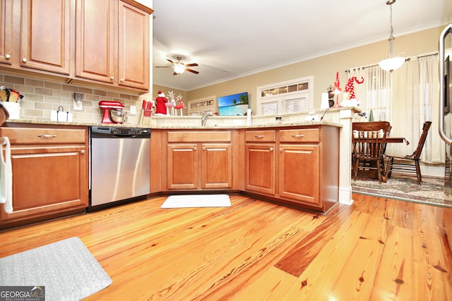 kitchen featuring ornamental molding, ceiling fan, light hardwood / wood-style flooring, dishwasher, and hanging light fixtures