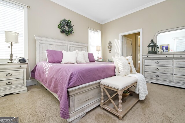 carpeted bedroom with ornamental molding