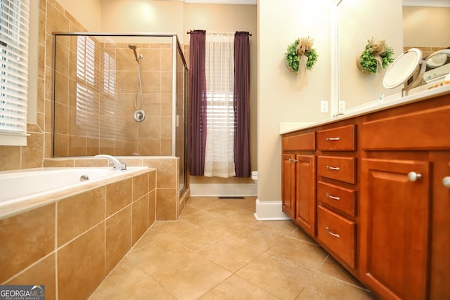 bathroom with tile patterned flooring, vanity, and an enclosed shower