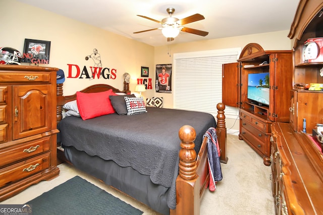 bedroom with light colored carpet and ceiling fan