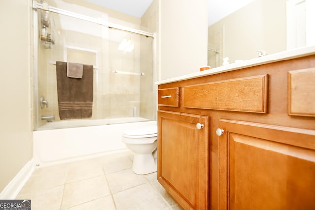 bathroom with bath / shower combo with glass door, toilet, and tile patterned floors