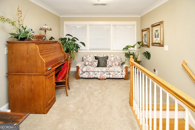 living area featuring ornamental molding and light carpet