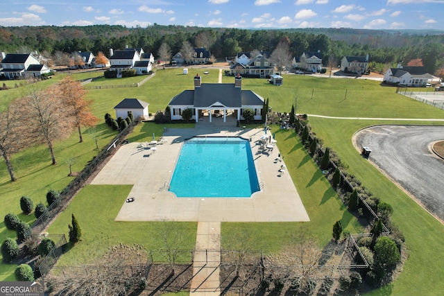 view of swimming pool with a residential view