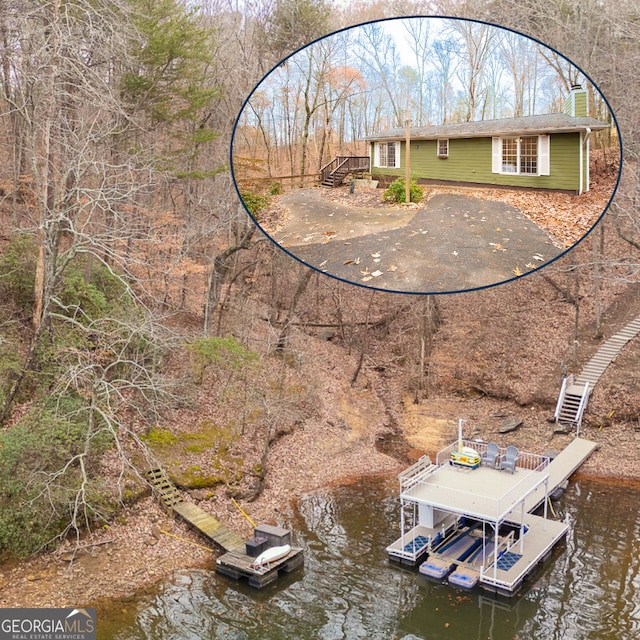 birds eye view of property featuring a water view