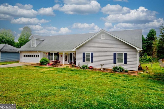 view of front of home featuring a garage and a front lawn