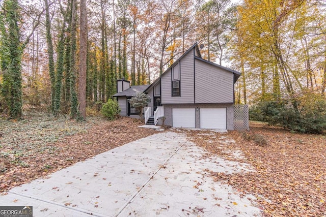 view of side of home featuring a garage