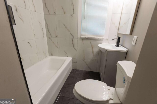 full bathroom with vanity, tile patterned flooring, toilet, shower with separate bathtub, and tile walls