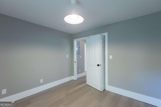 empty room with light hardwood / wood-style floors