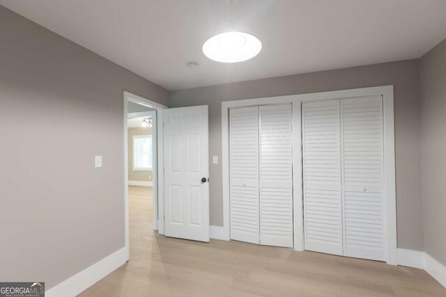 unfurnished bedroom featuring light wood-type flooring