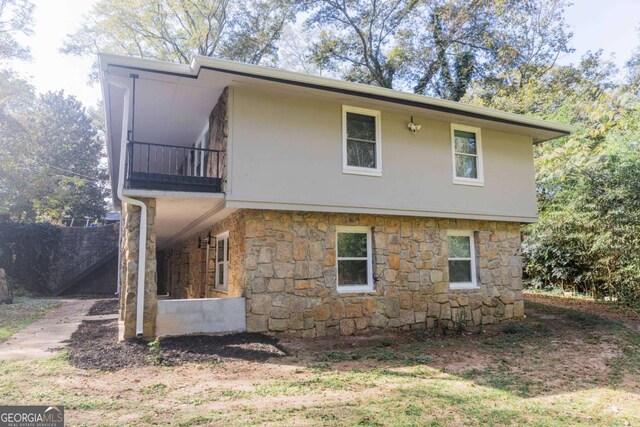 view of property exterior with a balcony