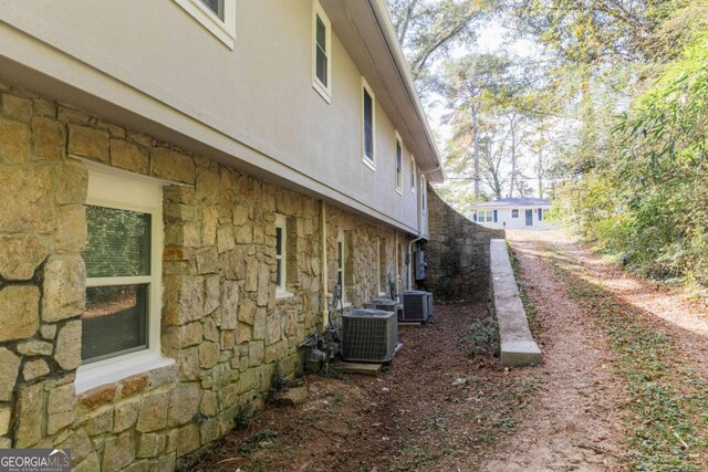 view of property exterior with central air condition unit