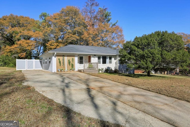 single story home featuring a front yard and covered porch