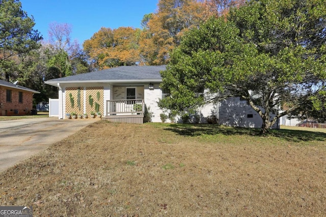 view of front of property with a front yard and a porch