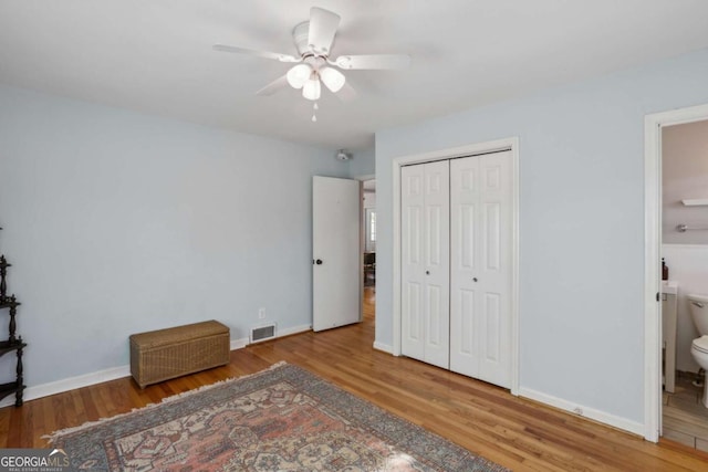 1522 Waltham Pl SE, Atlanta, GA 30316 - unfurnished bedroom with a closet, baseboards, ensuite bathroom, visible vents, and wood finished floors