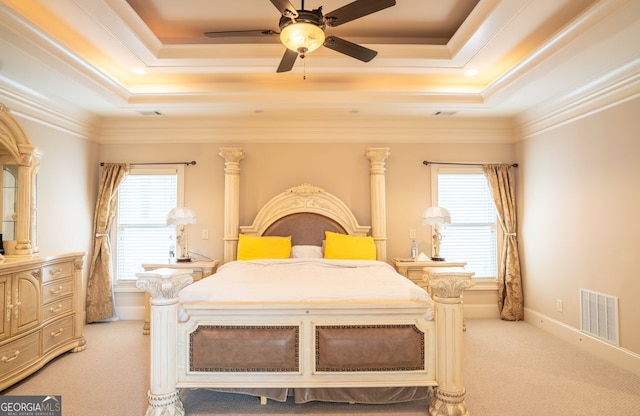 carpeted bedroom featuring multiple windows, ceiling fan, and ornamental molding