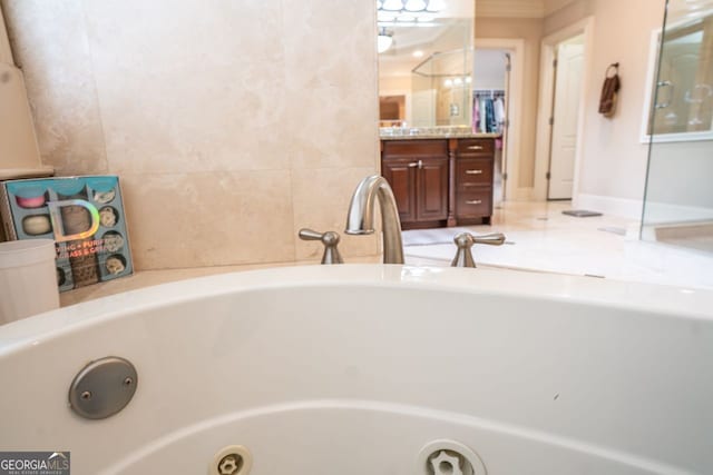 bathroom featuring a tub and vanity