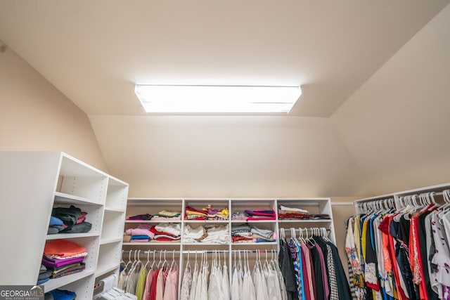 spacious closet featuring vaulted ceiling