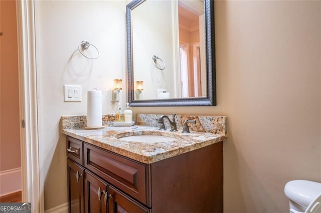 bathroom with vanity and toilet