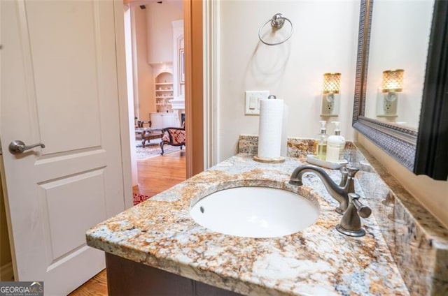 bathroom featuring hardwood / wood-style flooring and vanity