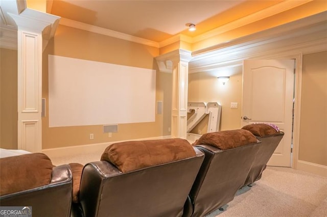 cinema with light carpet, ornate columns, and ornamental molding