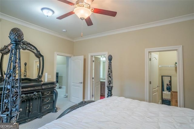 bedroom with connected bathroom, light carpet, ceiling fan, and ornamental molding