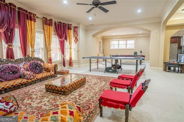 playroom featuring ceiling fan, light colored carpet, and ornamental molding