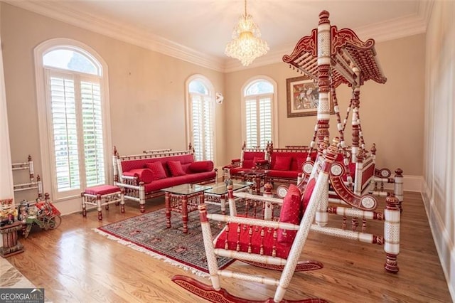 interior space with wood-type flooring, crown molding, and a healthy amount of sunlight