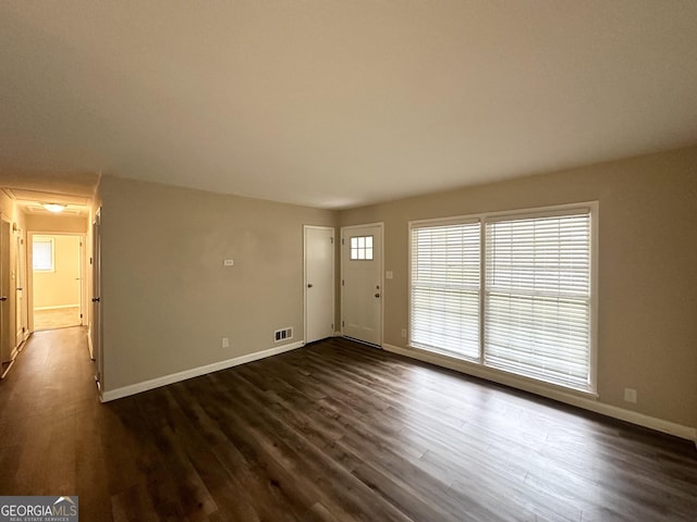 interior space with dark hardwood / wood-style floors