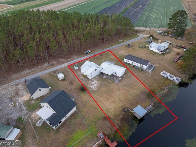 birds eye view of property featuring a rural view and a water view