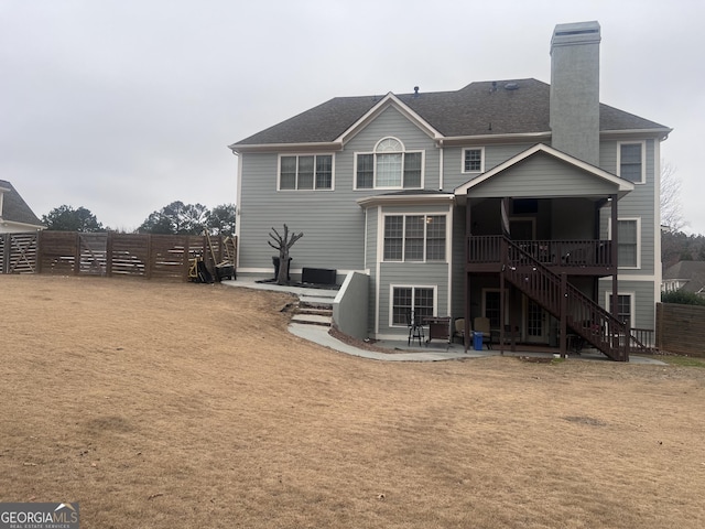 rear view of property featuring a patio area