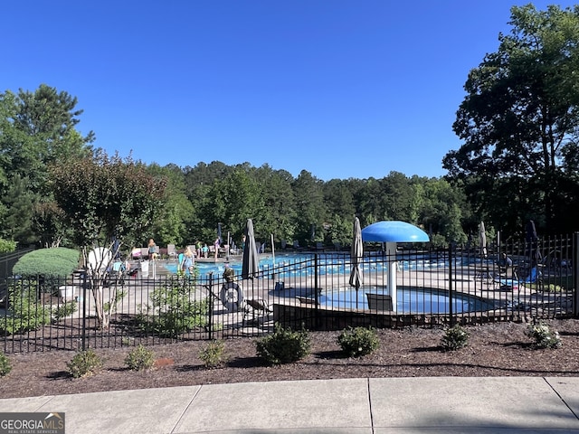 view of swimming pool with a patio area