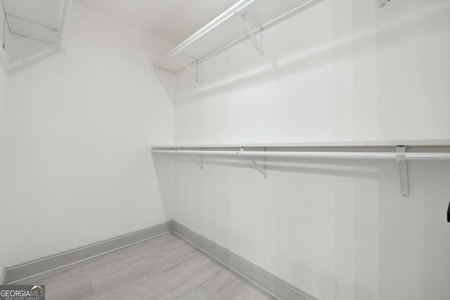 walk in closet featuring light wood-type flooring