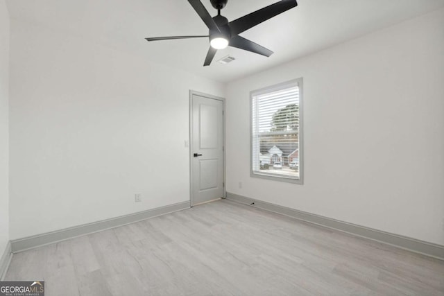 unfurnished room featuring ceiling fan and light hardwood / wood-style floors