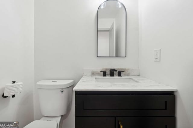 bathroom with vanity and toilet