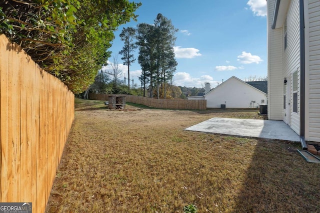 view of yard featuring cooling unit and a patio area