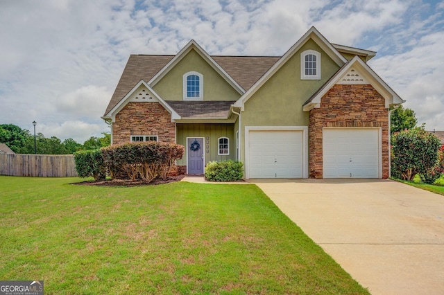 view of front of property with a front yard and a garage