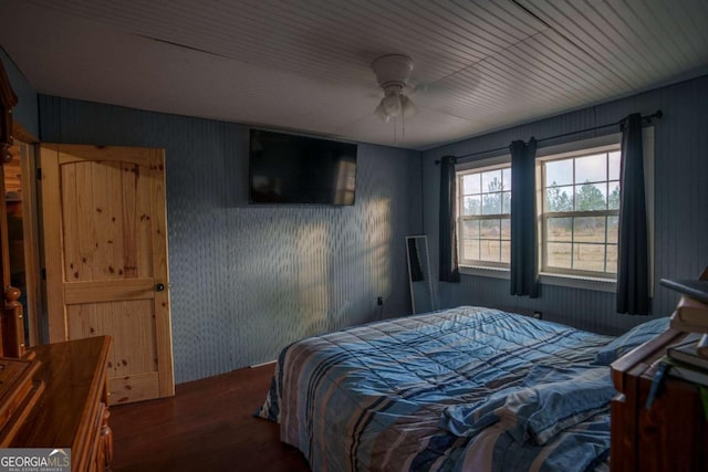 bedroom featuring ceiling fan and dark hardwood / wood-style floors