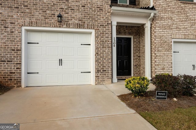 entrance to property featuring a garage