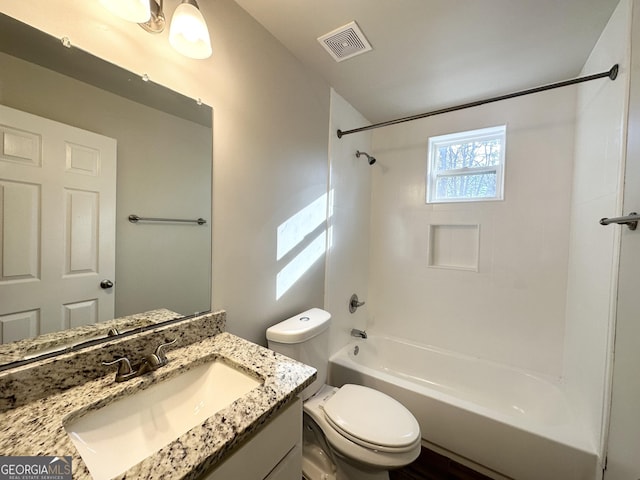 full bathroom with vanity, toilet, and tiled shower / bath