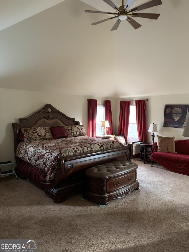 bedroom with ceiling fan, carpet floors, and lofted ceiling