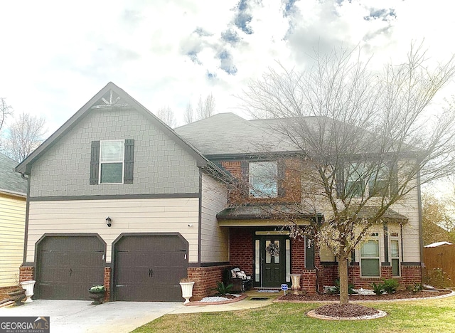 view of front of property featuring a front yard and a garage