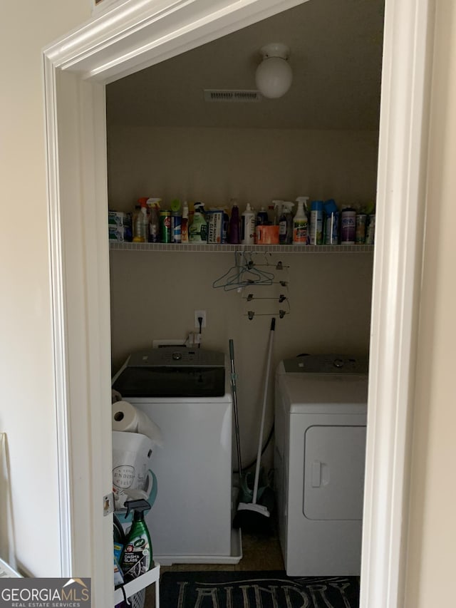 washroom with separate washer and dryer