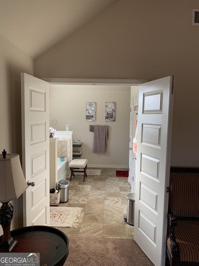 bathroom with vaulted ceiling