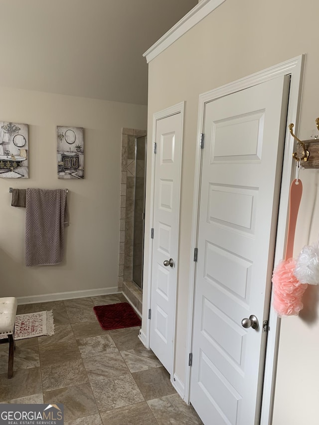 bathroom with a shower with shower door