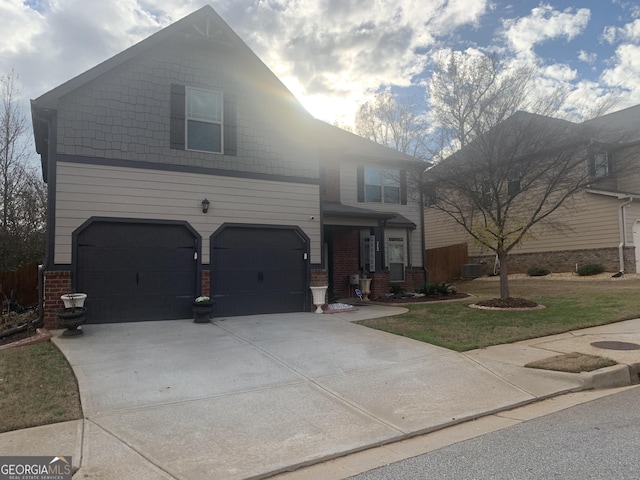 view of front of house featuring a front yard and a garage