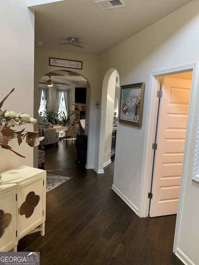 hall featuring dark wood-type flooring